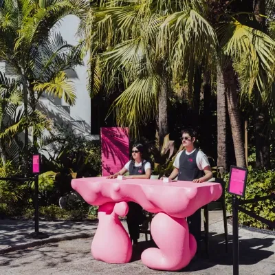 Pink garden furniture arranged in the courtyard for guests
