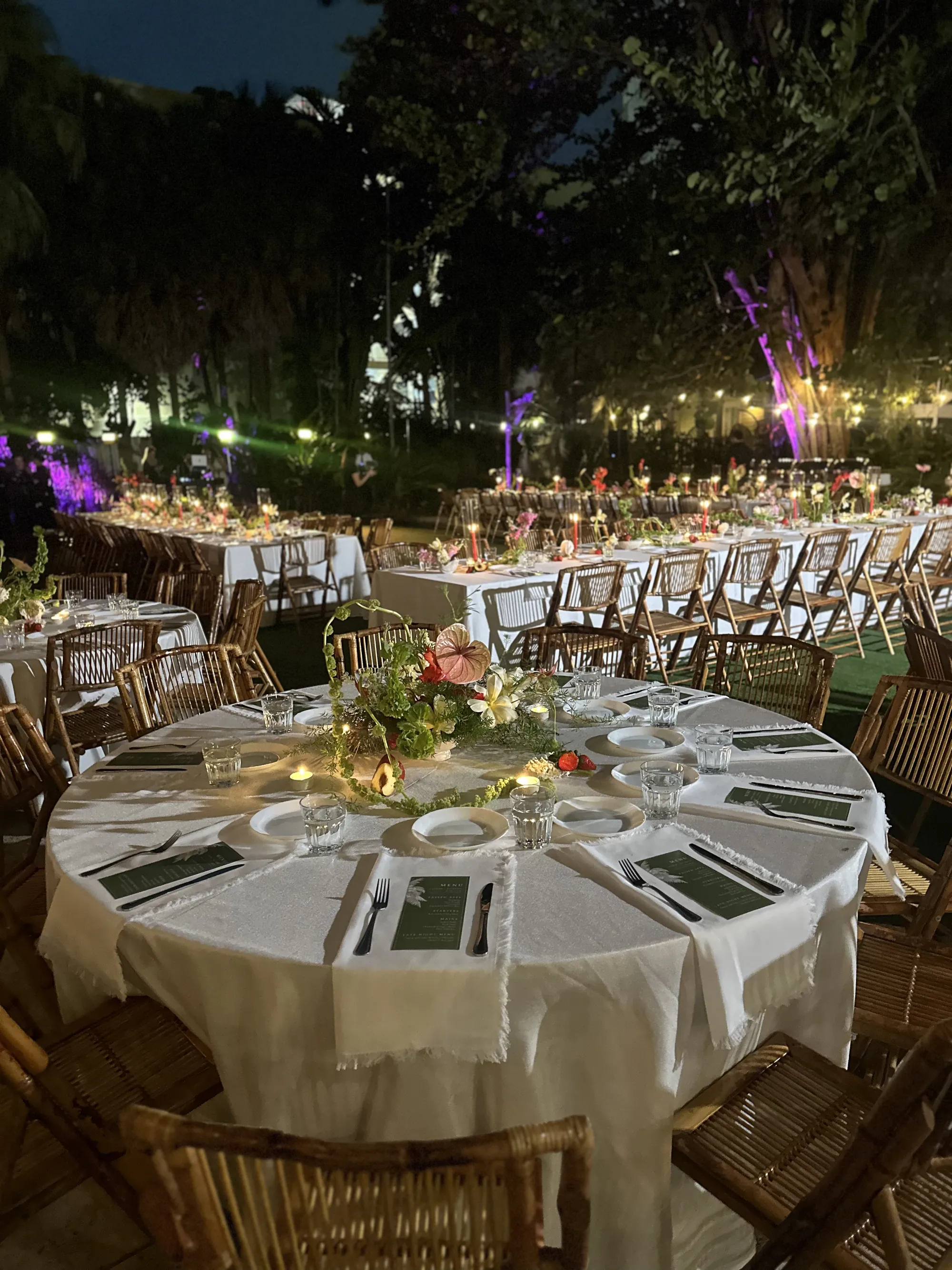 Round tables laid for a reception in the garden