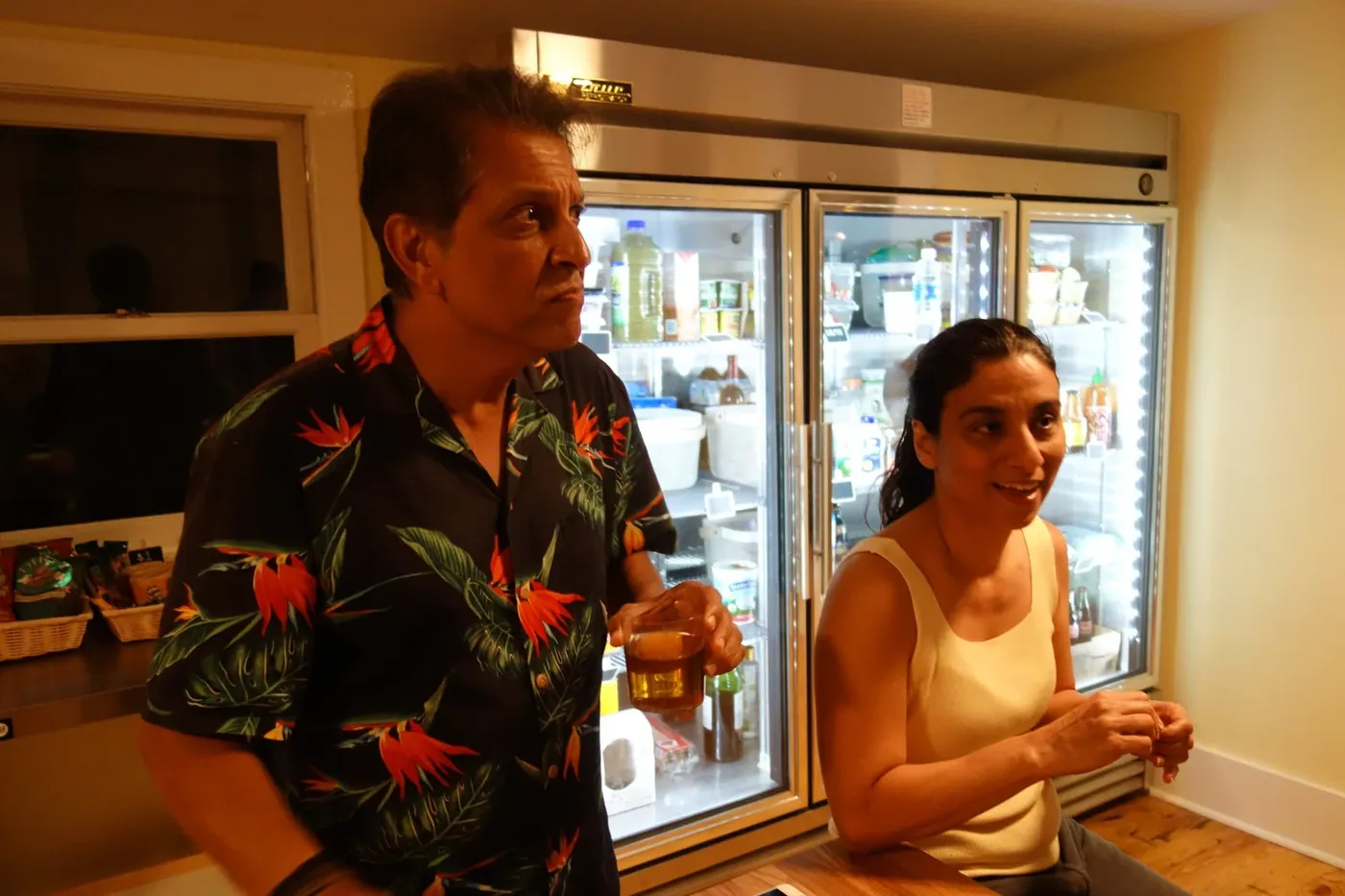 Guests talking in the shared kitchen